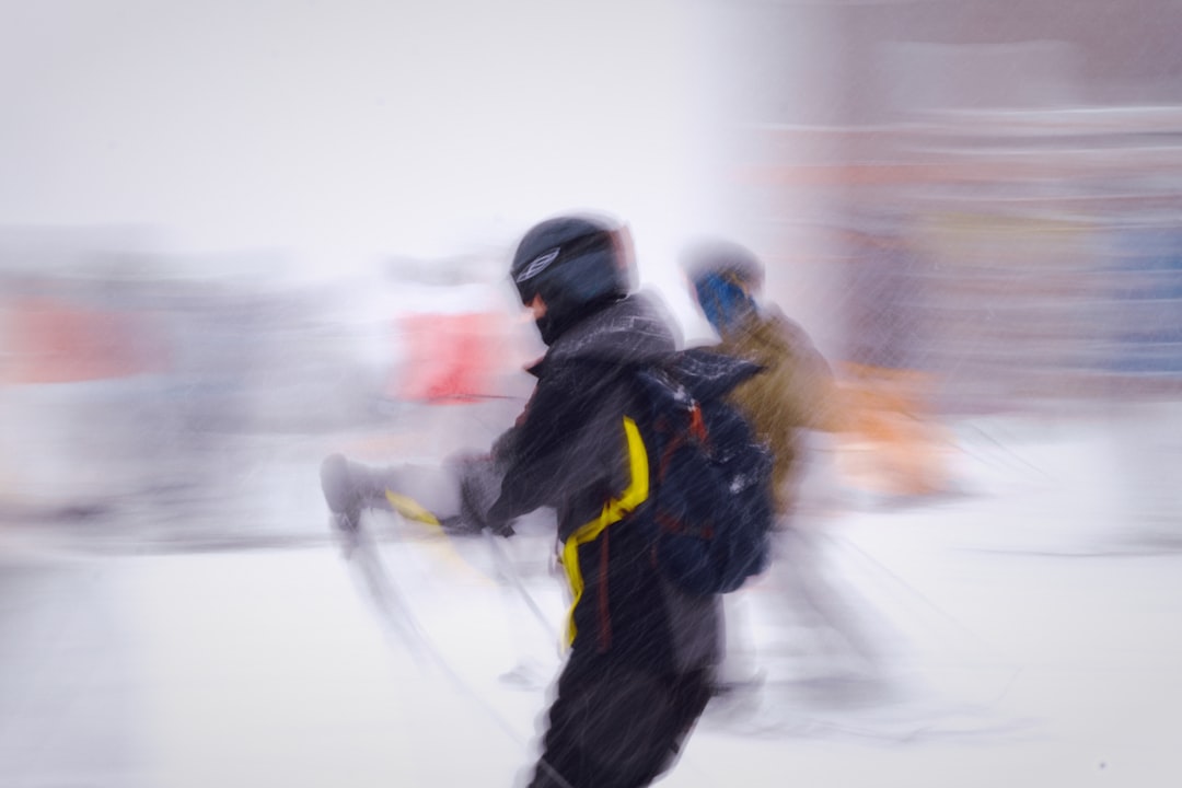 why-choose-us a-blurry-photo-of-two-people-skiing-down-a-hill-z4jvko9uvom